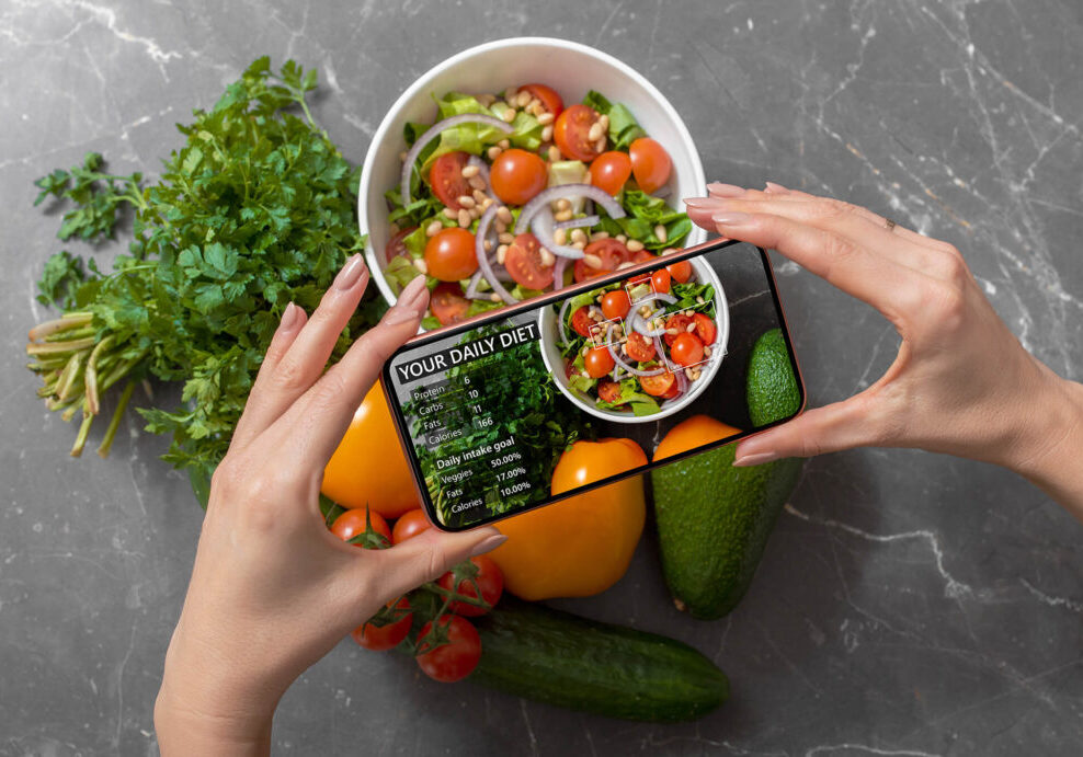 Person using smartphone to track nutrition facts and calories in her food