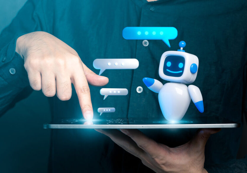 Person interacting with a friendly AI chatbot on a tablet