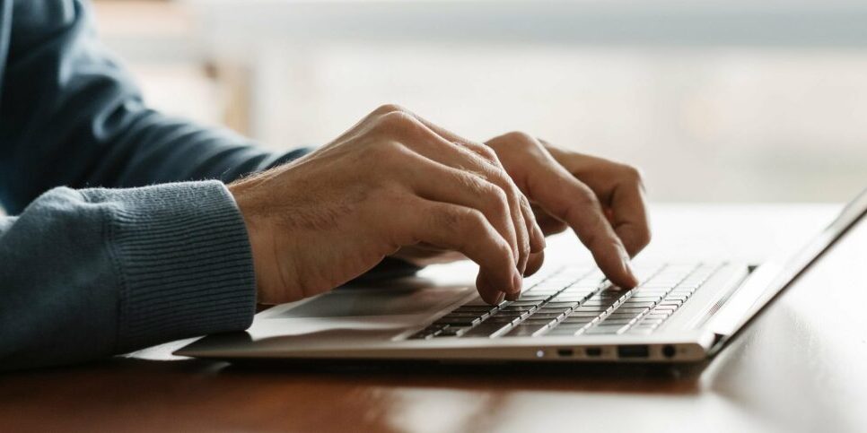 Man typing on Laptop