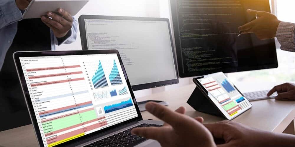 Business team looking at analytics report