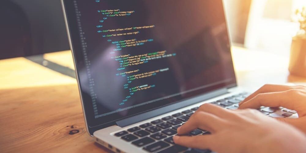 coding html and programming on screen laptop